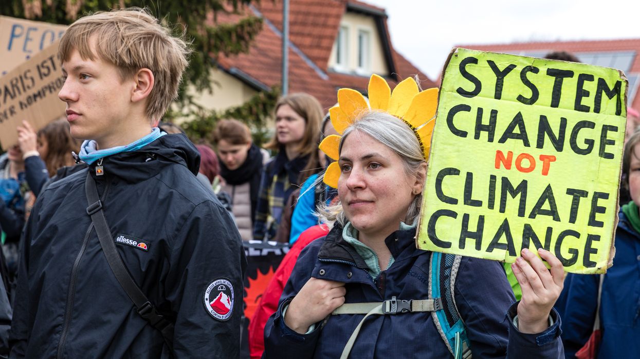 Climate activists attend a protest