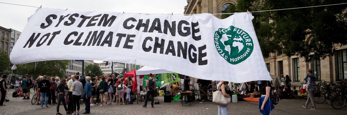 Climate activists attend rally on Earth Overshoot Day