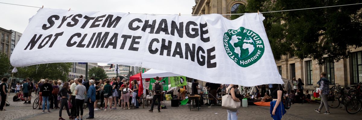 Climate activists attend rally on Earth Overshoot Day