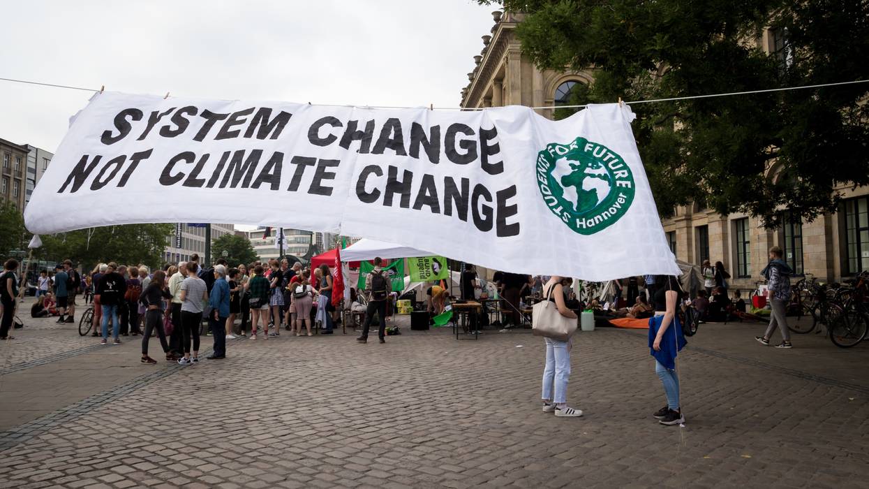 Climate activists attend rally on Earth Overshoot Day