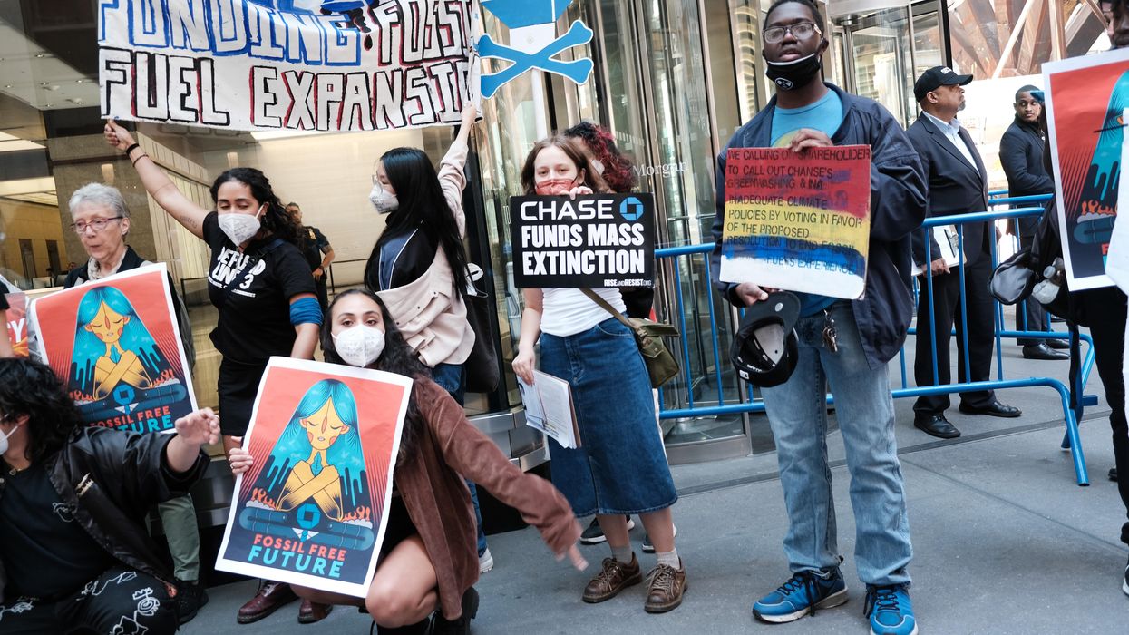 Climate activists demonstrate outside the headquarters of JPMorgan Chase during the bank's annual shareholder meeting on May 17, 2022 in New York City.