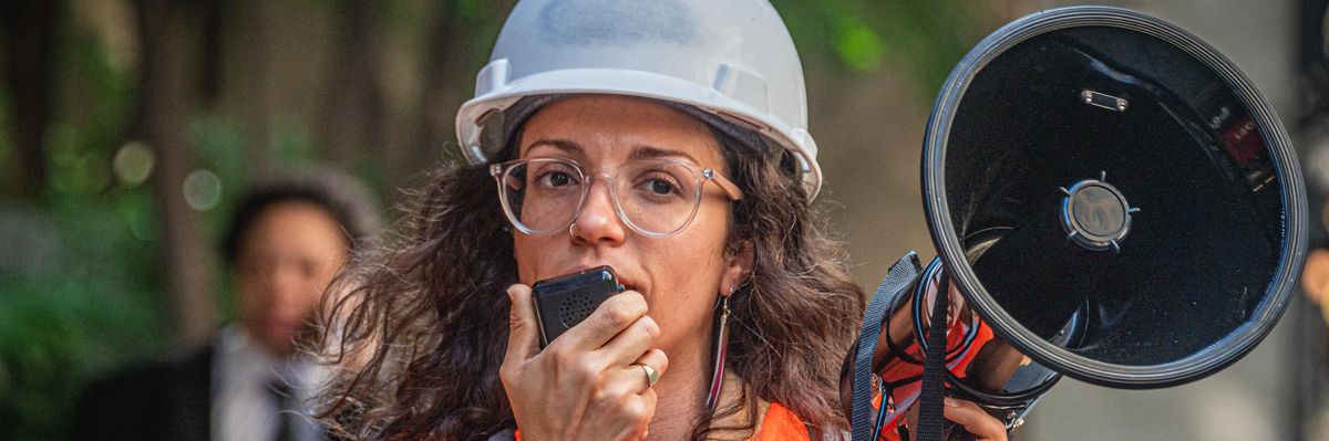 Climate activists holding a bullhorn