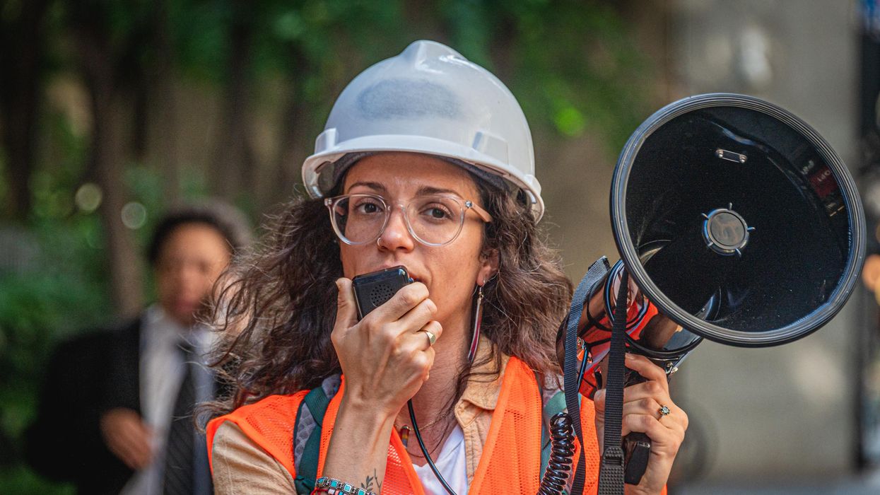 Climate activists holding a bullhorn