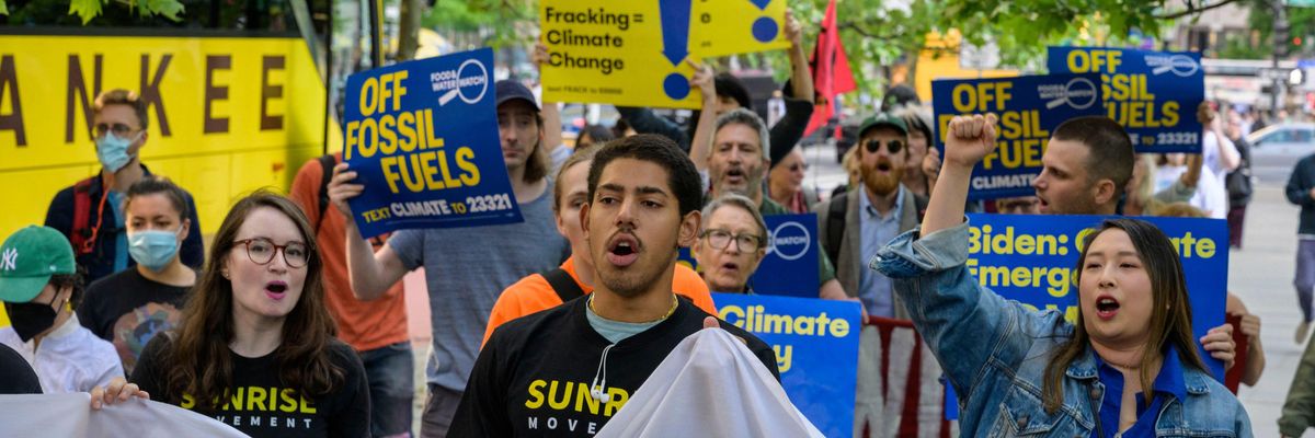 Climate activists marched as President Joe Biden attended a campaign reception