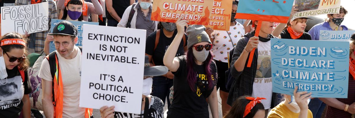 Climate activists participate in a march from Freedom Plaza to Capitol Hill on October 15, 2021 in Washington, D.C.