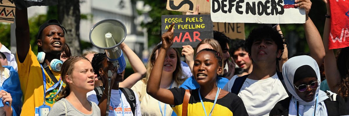 Climate activists protest a planned oil pipeline in East Africa