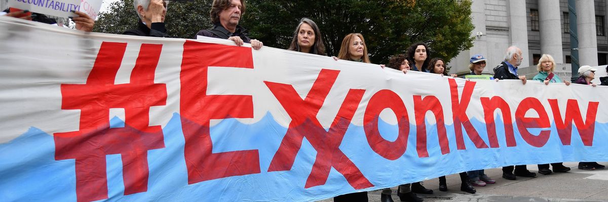 Climate activists protest during the Exxon trial