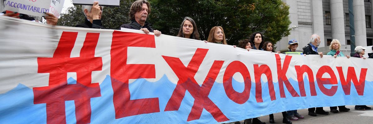 Climate activists protest during the Exxon trial