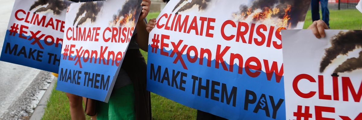 Climate activists protest outside ExxonMobil's annual shareholder meeting on May 29, 2019 in Irving, Texas.