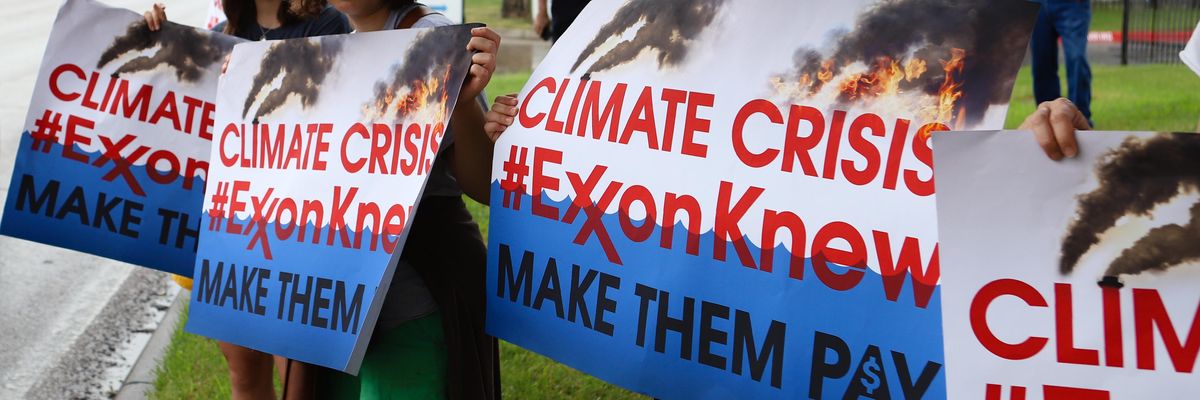 Climate activists protest outside ExxonMobil's annual shareholder meeting on May 29, 2019 in Irving, Texas.