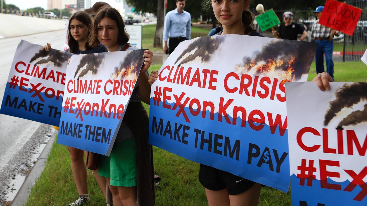 Climate activists protest outside ExxonMobil's annual shareholder meeting on May 29, 2019 in Irving, Texas.