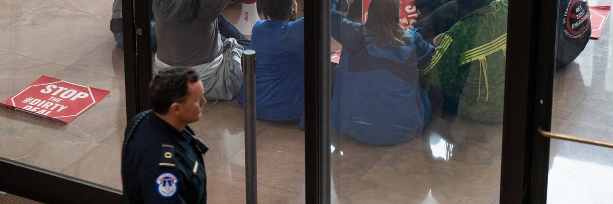 Climate activists protest Sen. Joe Manchin's "dirty deal"