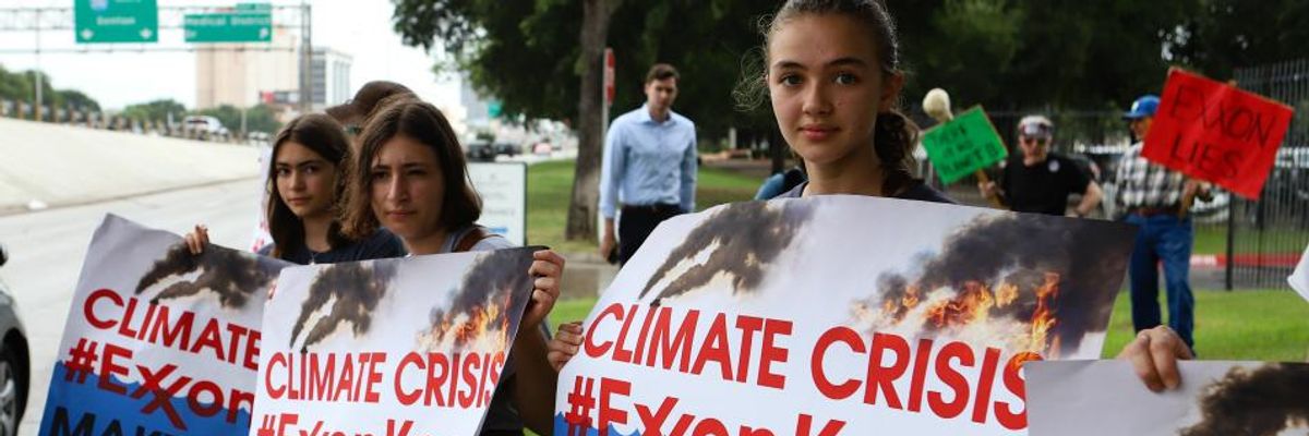 #MakeThemPay: Demonstrators Call Out ExxonMobil for Climate Crimes at Shareholders Meeting