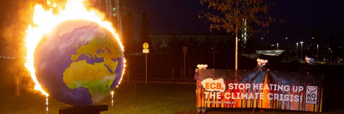 'Stop Financing Climate-Wrecking Companies': Campaigners Light Earth on Fire Outside European Central Bank HQ