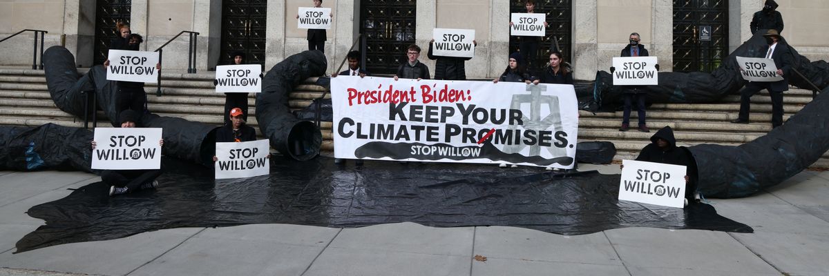 Climate activists urge President Joe Biden to reject the Willow oil project outside the U.S. Department of the Interior in Washington, D.C. on November 17, 2022.