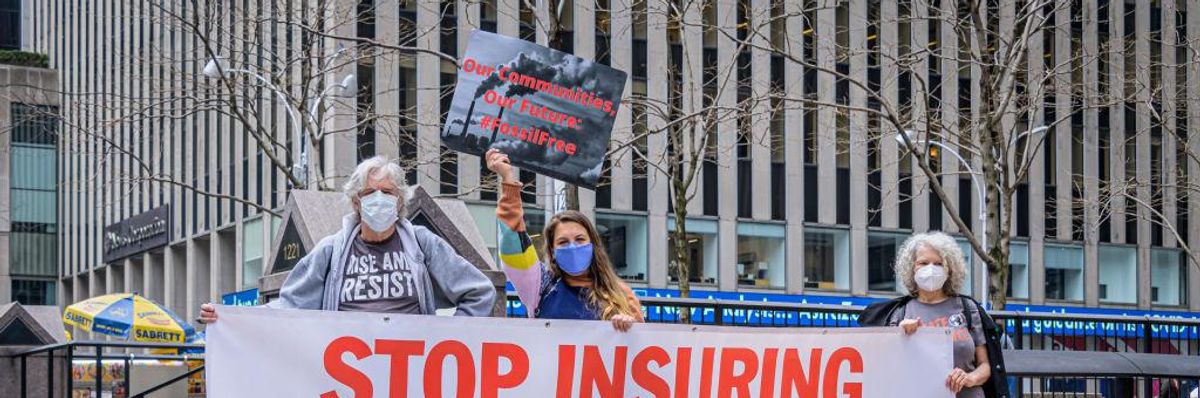Climate activists, working with the Insure Our Future Network, gathered in Manhattan on March 25, 2021 to urge insurance giants to stop underwriting and investing in fossil fuel projects.