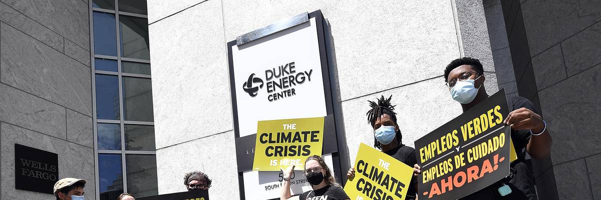 Climate campaigners outside Duke Energy Center