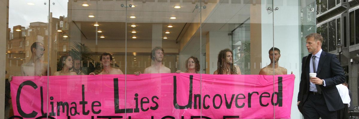 Climate change campaigners stage a naked demonstration at the offices of PR company Edelman, in Victoria, London, in protest against Edelman's PR work for energy company E.On on September 1, 2009.