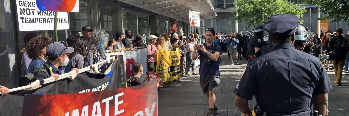 climate protestors holding banners