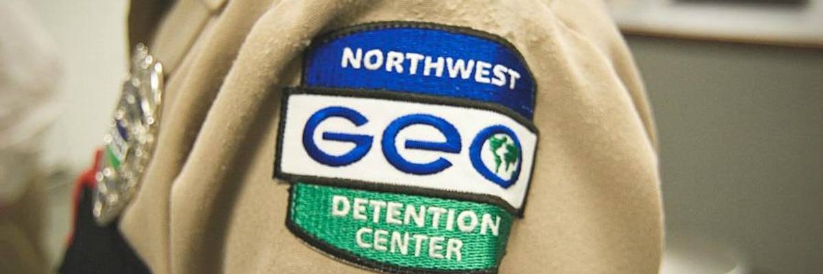 Close-up of private prison guard badge.