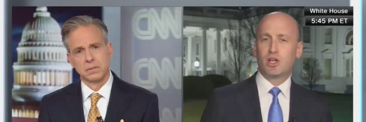 CNN anchor Jake Tapper listens as White House Deputy Chief of Staff Stephen Miller speaks in an interview