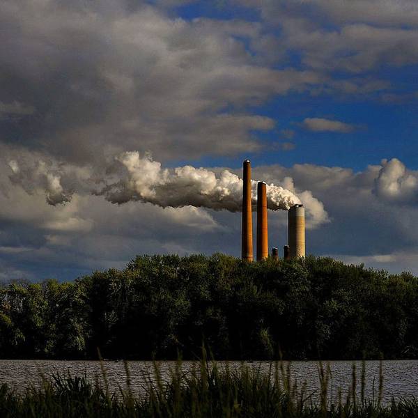 coal power plant smokestack spews