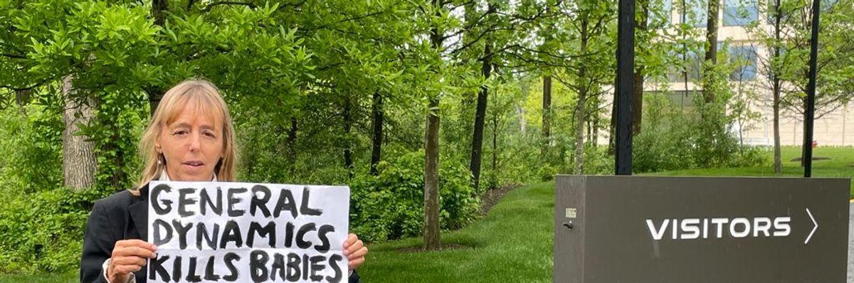 CODEPINK co-founder Medea Benjamin standing outside of General Dynamics’ headquarters in Reston, Virginia