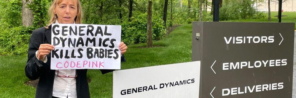 CODEPINK co-founder Medea Benjamin standing outside of General Dynamics’ headquarters in Reston, Virginia