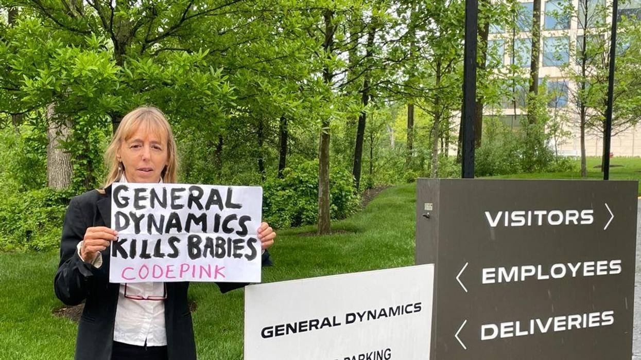 CODEPINK co-founder Medea Benjamin standing outside of General Dynamics’ headquarters in Reston, Virginia