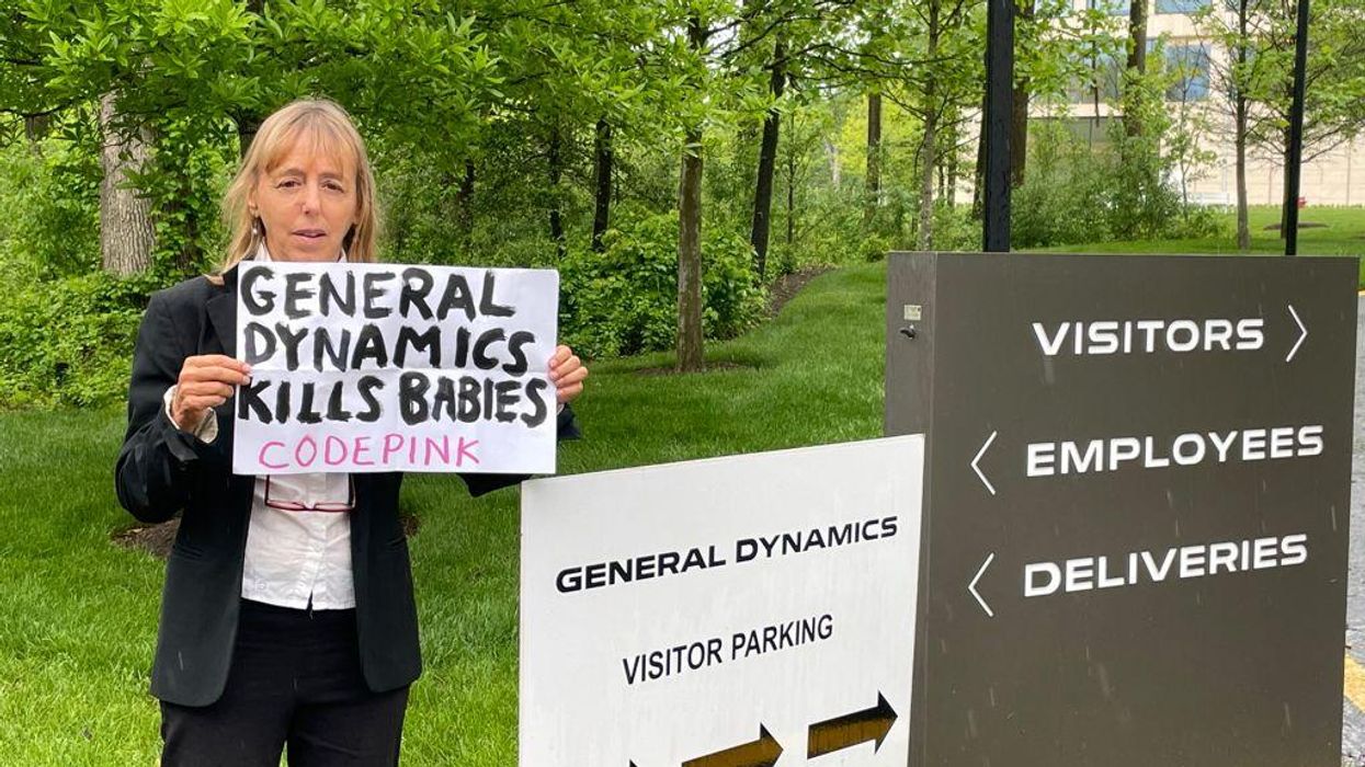 CODEPINK co-founder Medea Benjamin standing outside of General Dynamics’ headquarters in Reston, Virginia