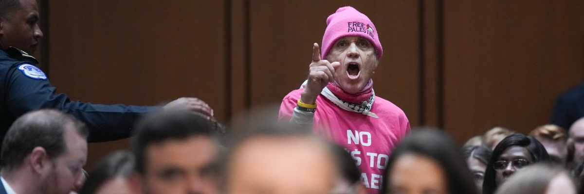 CODEPINK member interrupts hearing.