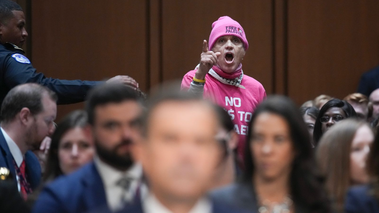 CODEPINK member interrupts hearing.