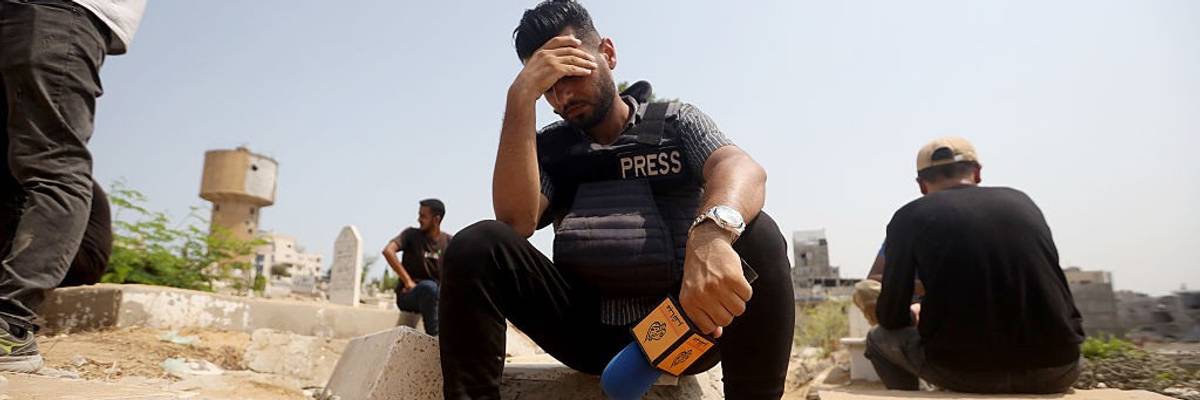 Colleagues of Al Jazeera journalists killed by Israel mourn.