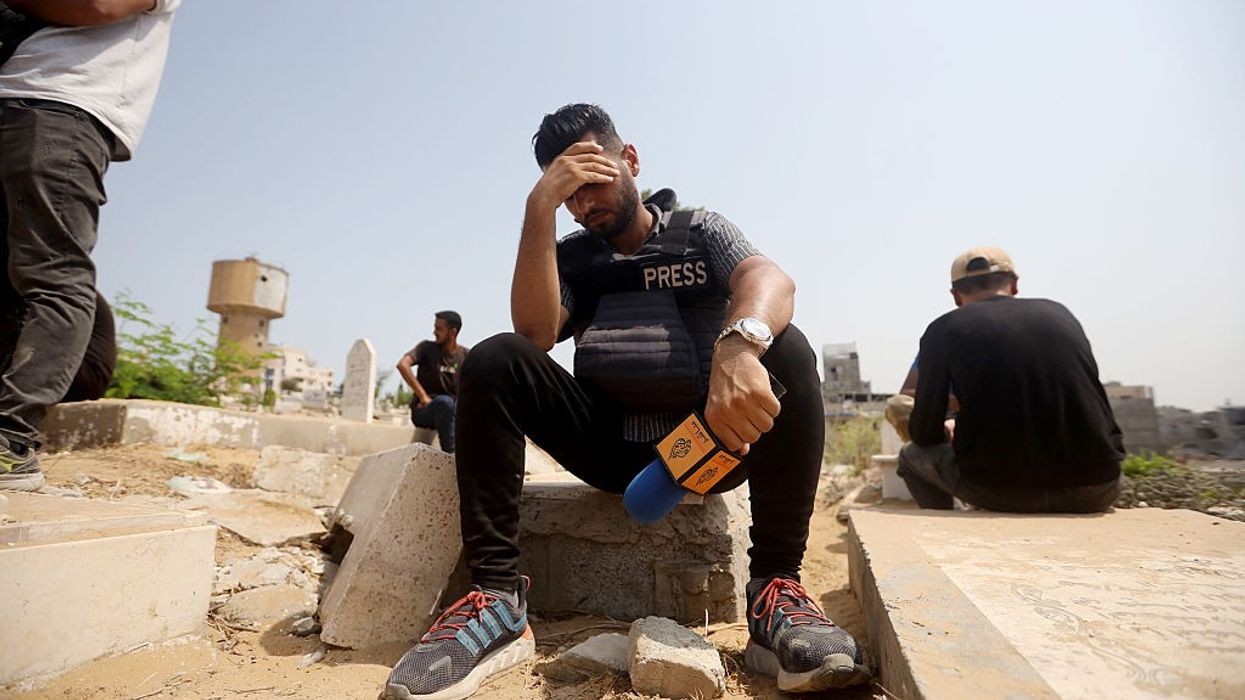 Colleagues of Al Jazeera journalists killed by Israel mourn.