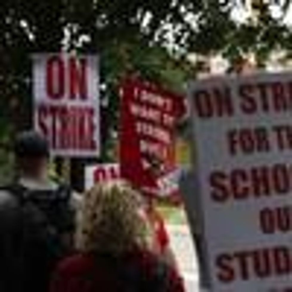 Columbus City School teachers strike outside of Livingston Elementary School in Columbus, Ohio on August 22, 2022.