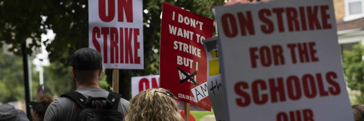 Columbus City School teachers strike outside of Livingston Elementary School in Columbus, Ohio on August 22, 2022.
