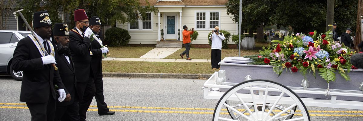 Community members honor victim of Wilmington Coup.