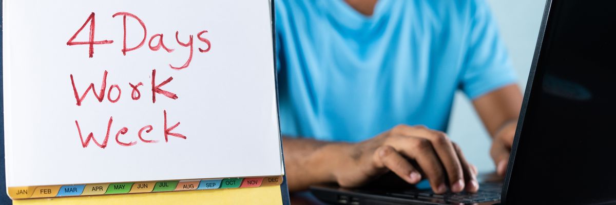 Concept of four or 4 days work week showing by young man working in background