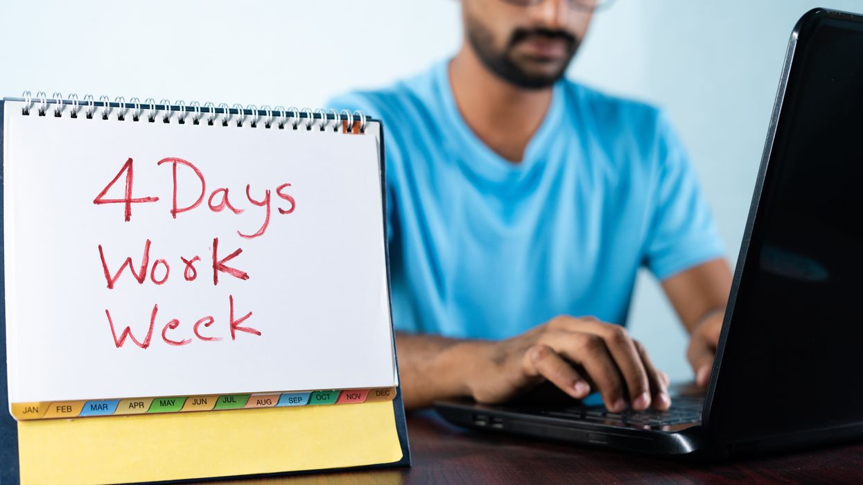 Concept of four or 4 days work week showing by young man working in background