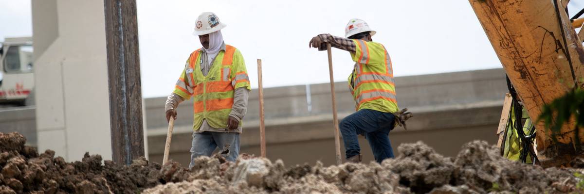 Construction workers rebuild the I-69 Southwest/I-610 West Loop Interchange during a heatwave in Houston