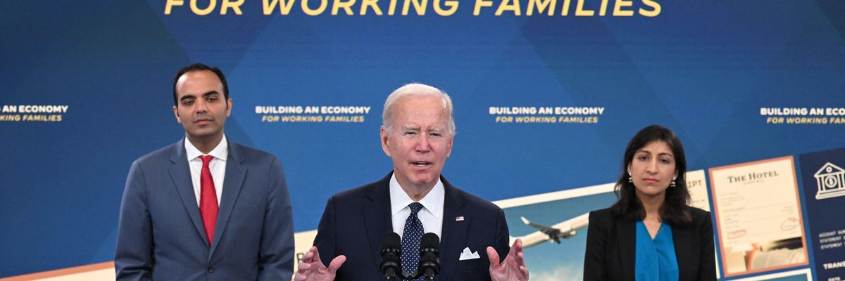 Consumer Financial Protection Bureau Director Rohit Chopra (L) and Federal Trade Commission Chair Lina Khan (R) listen as U.S. President Joe Biden speaks in Washington, D.C. on October 26, 2022.