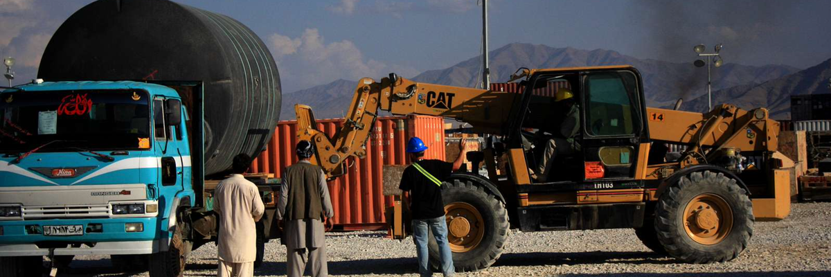 Contractors load water tank