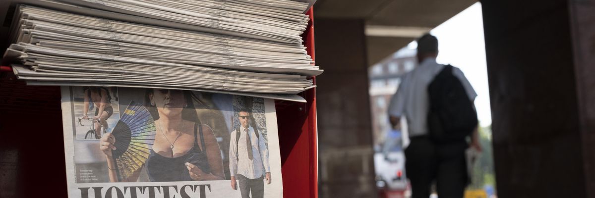 Copies of the Evening Standard at Victoria Station report on the hottest day in U.K.'s history
