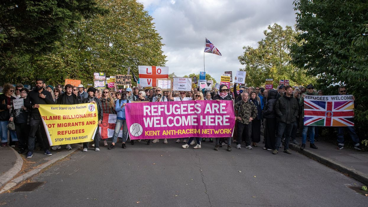 Counter-protester hold their banners, placards and flags...
