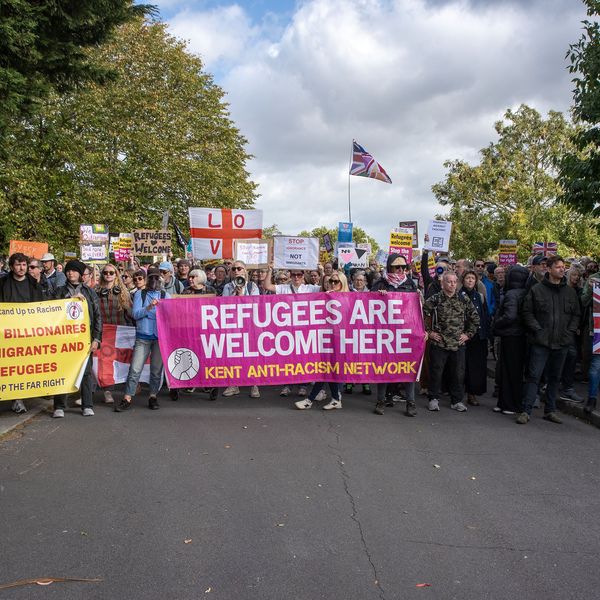 Counter-protester hold their banners, placards and flags...