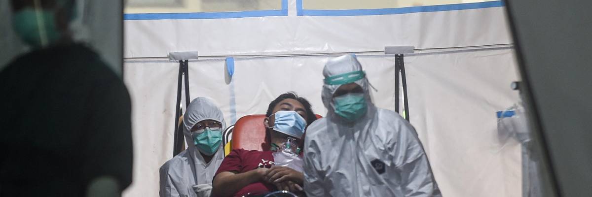 Covid-19 patient on a stretcher in Indonesia