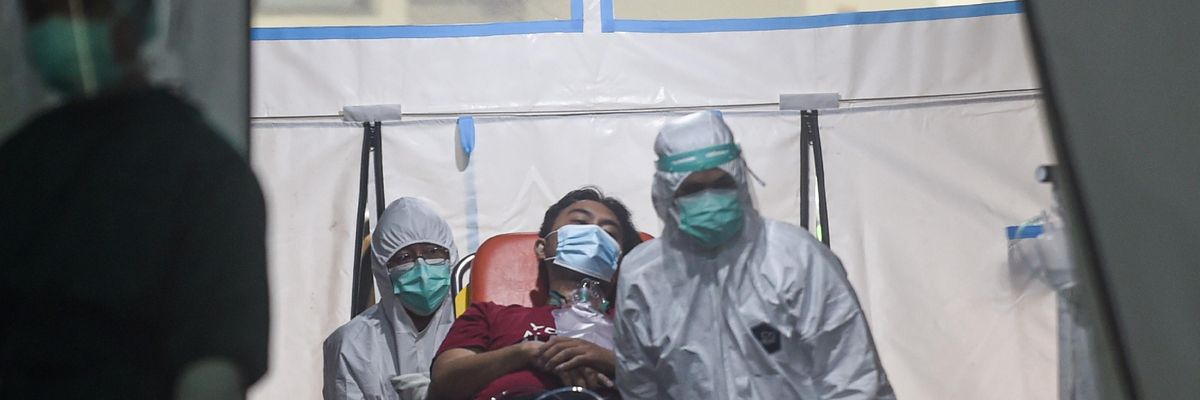 Covid-19 patient on a stretcher in Indonesia
