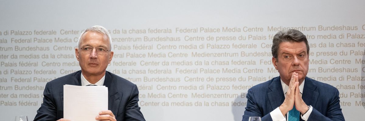 Credit Suisse chairman Axel Lehmann (L) and UBS Chairman Colm Kelleher attend a press conference