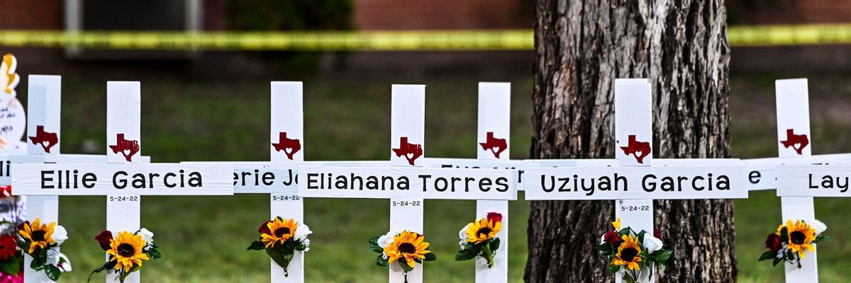 Crosses adorn a makeshift memorial for the shooting victims at Robb Elementary School in Uvalde, Texas, on May 26, 2022.