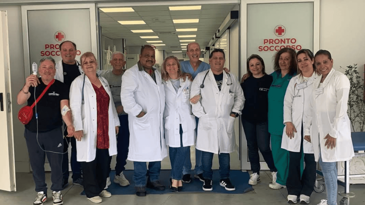 Cuban and Italian doctors pose for a photo in Calabria